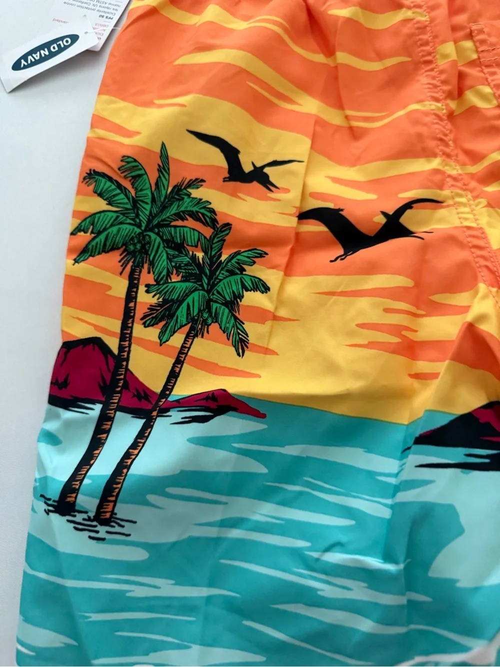 (NWT) Old Navy Boy’s Dinosaur 🦖 Swim Trunks in Orange/Multi, Large (10/12)